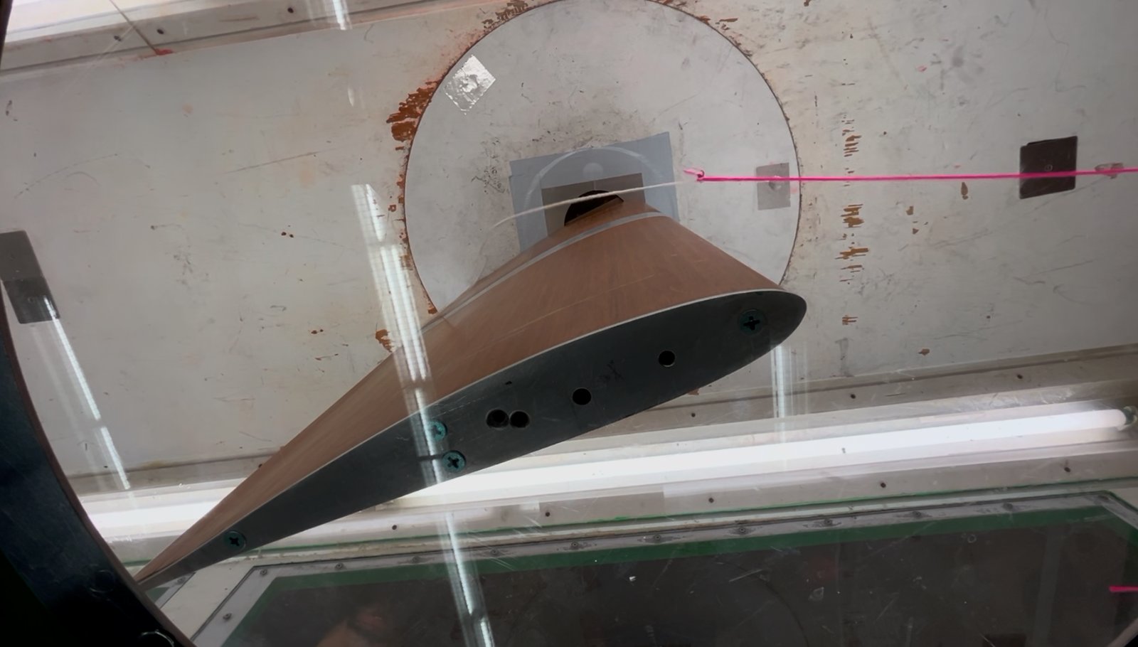 The model after stall, seen through the side window. The tuft on the turntable disc shows the local flow direction (photo: MECH 489 Lab 2 group).